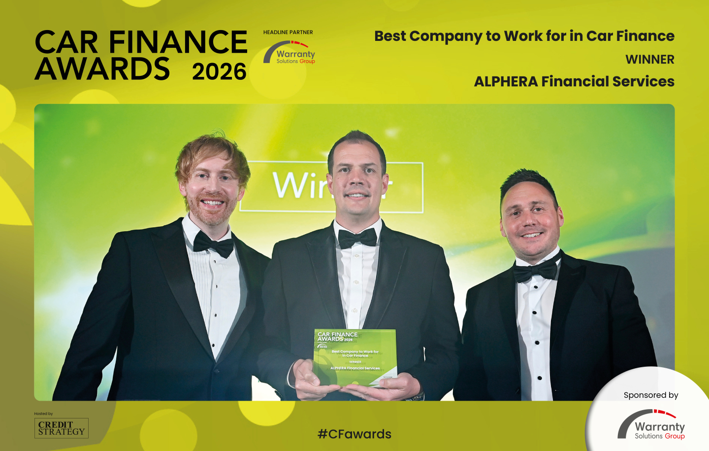 Winners photo with three men on stage at CFA