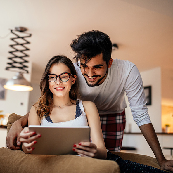 Young couple looking at a tablet